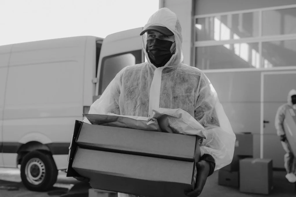 A man carrying frozen food inside Cold room